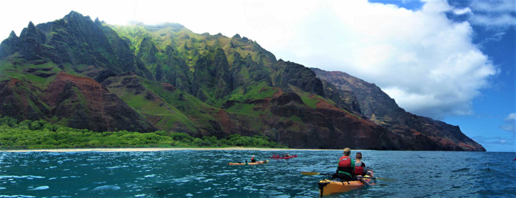 Kayak paddlers on the Napali Coast in Kauai, Hawaii