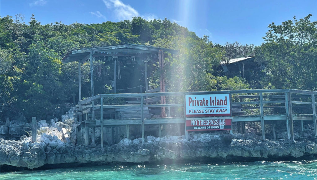 Clear sign warding off visitors from Carlos Lehder's former compound off Norman's Cay, Bahamas
