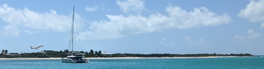 View from our anchorage of Bombardier Global Express private jet departing from Norman's Cay airport