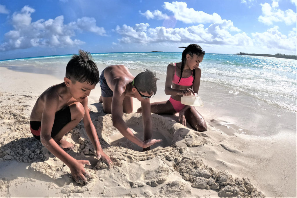 Making Sand Castles on the beach at Shroud Cay, Bahamas