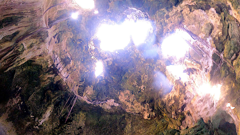 Sunlight rushing into the cave at Thunderball Grotto off Staniel Cay, Bahamas