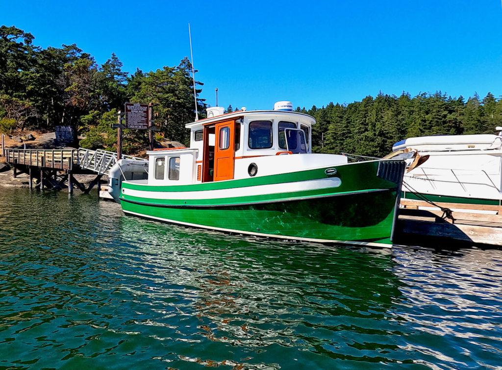 Nordic Tug 26 docked in Fossil Bay on Sucia at high tide
