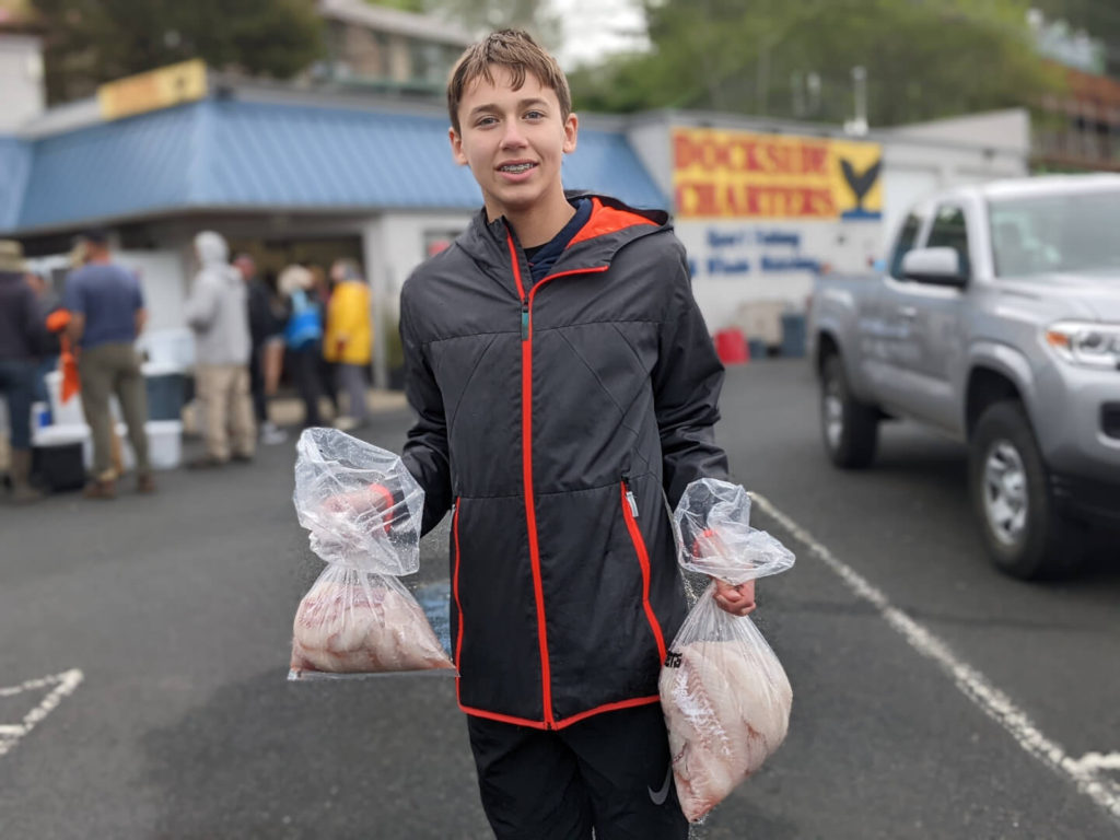 George holding two bags of fileted rockfish filets