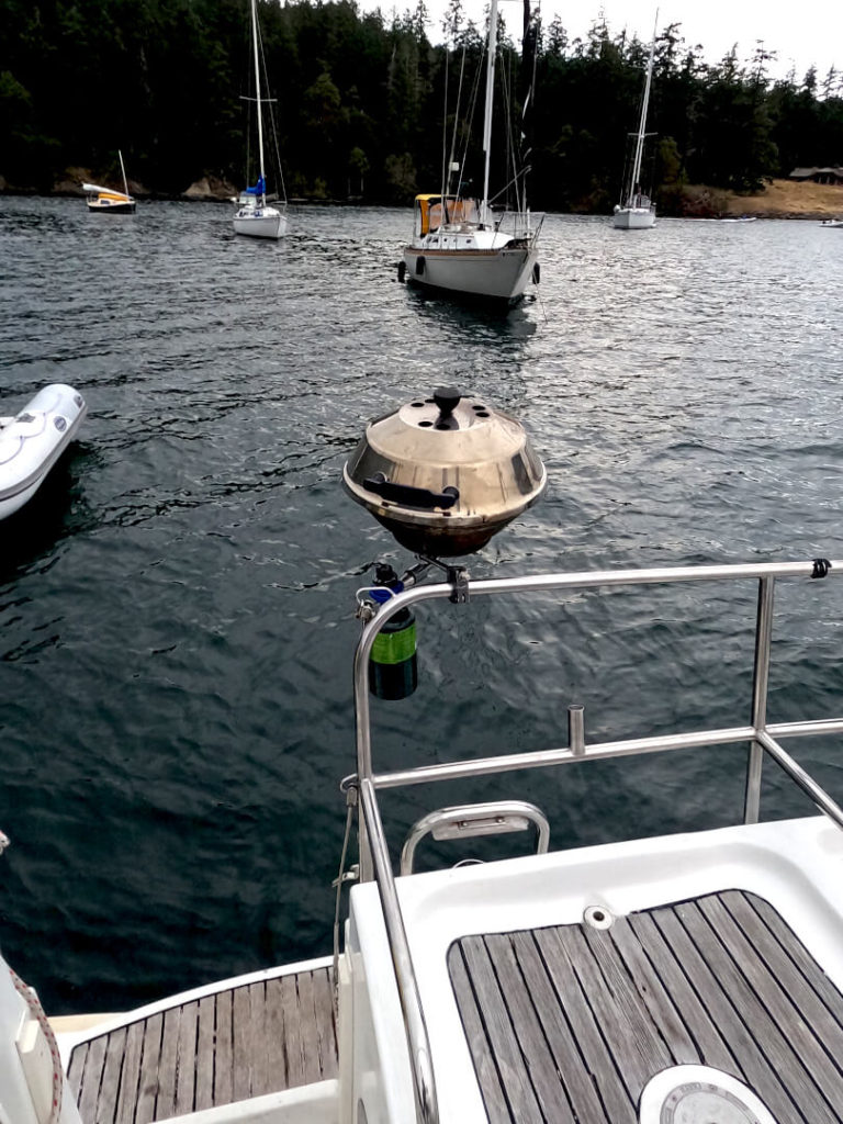 Magma propane grill mounted on the stern rail of Jeanneau 43 DS in Friday Harbor anchorage